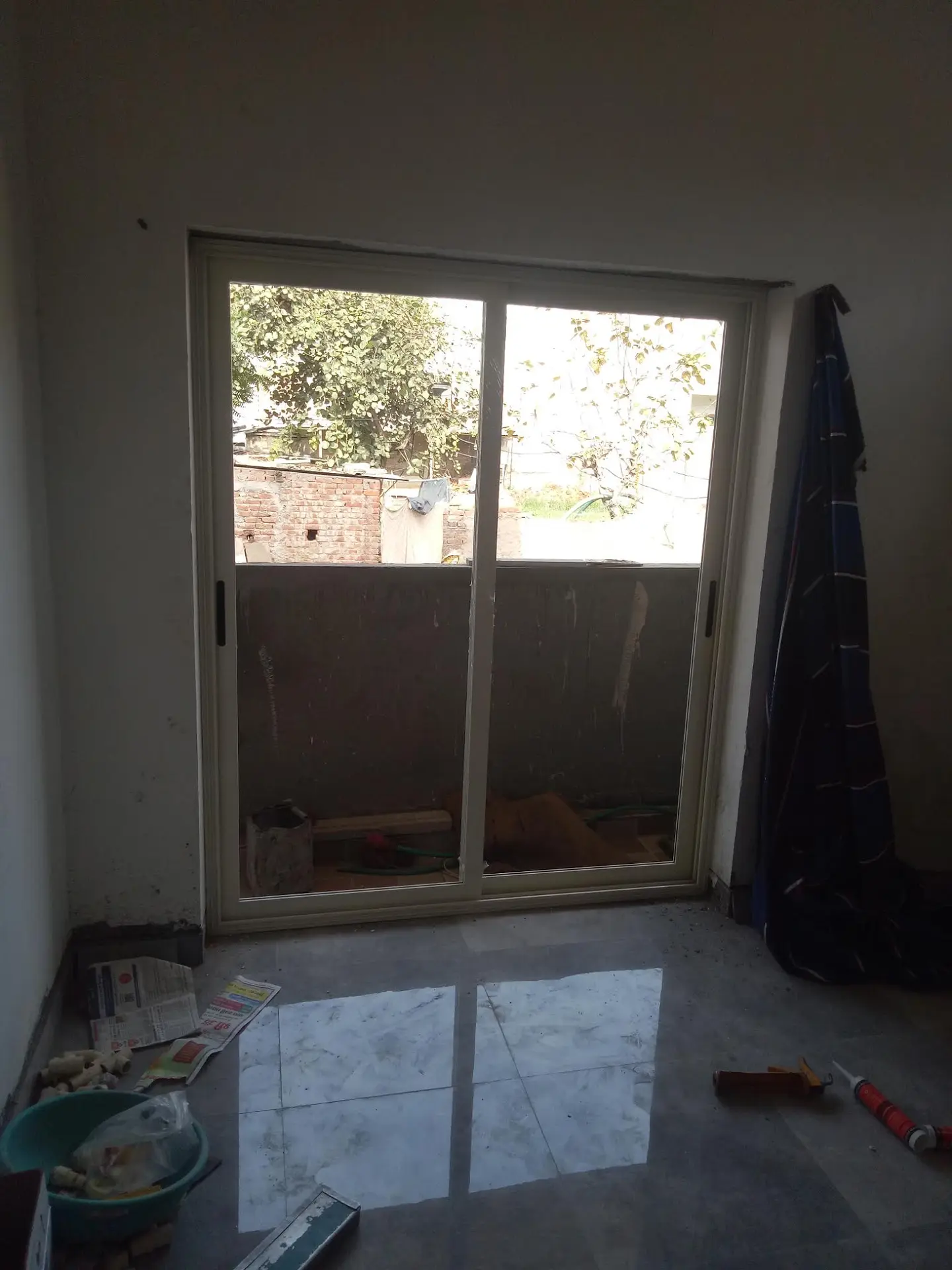 Aluminium sliding door installation with large glass shutters